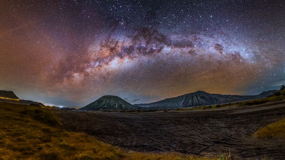 Stunning night view of the Milky Way arching over Mount Bromo in East Java, Indonesia.